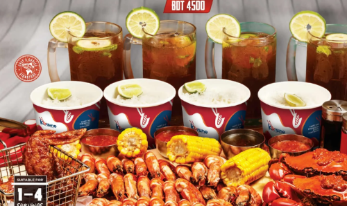 The Kuisine Grail seafood platter with crab, shrimp, corn and rice