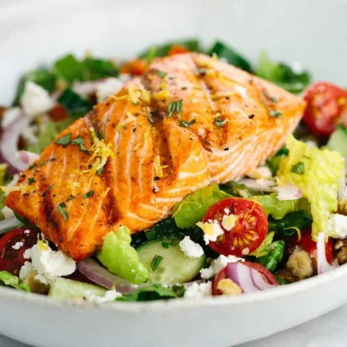 Fresh garden salad with greens, grilled protein and vinaigrette